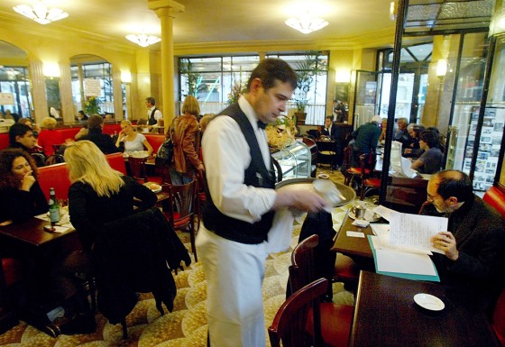Business bustles at the Cafe de Flore in Paris.