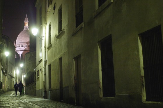 A couple walks along a street on Montmar