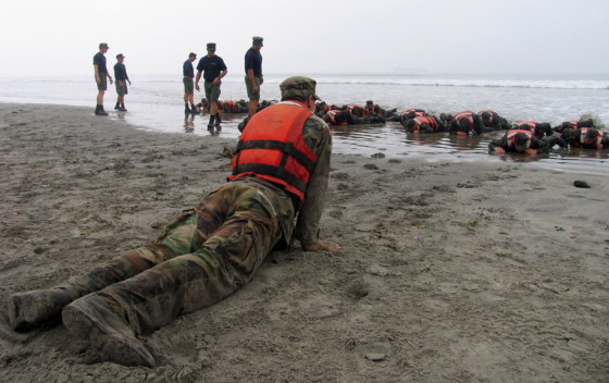 U.S. Navy Sea, Air, Land (SEAL) recruits training on the beach at the Naval Special Warfare Center in Coronado, California&nbsp;during "Hell Week." 