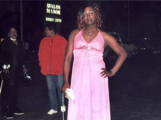 Kevin Logan, 18, poses for a photo after being denied entry into West Side High School's prom Friday in Hobart, Ind.