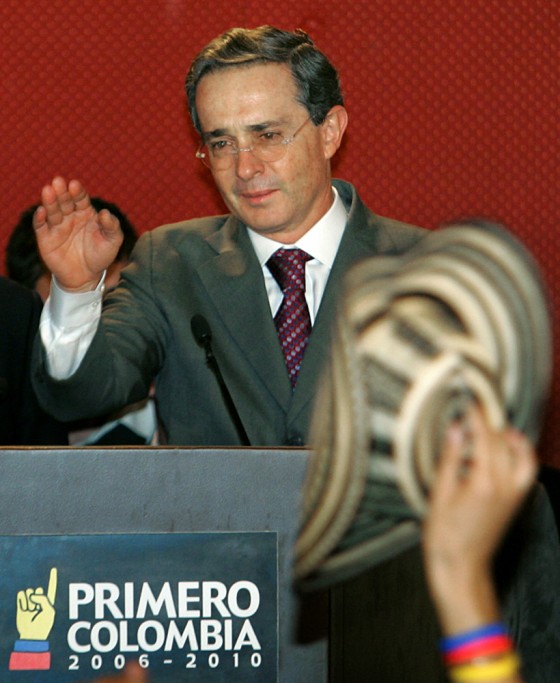 Colombian president Alvaro Uribe waves a