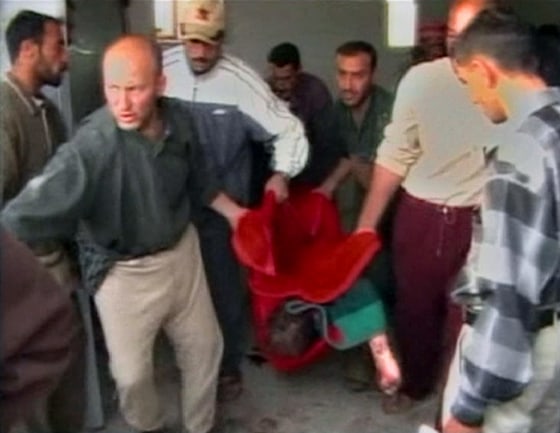 Video grab shows body being carried in Haditha