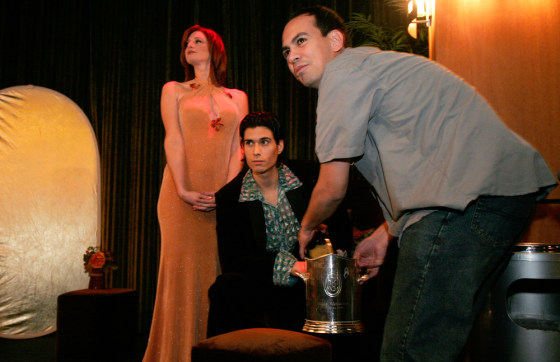 Jeanette Dove, left, and Marcelo Rocabado, right, oversee a photo shoot for their bilingual magazine Two Mundos. A growing number of professional companies in the Washington, D.C., area are owned and run by Latinos in their mid-20s.