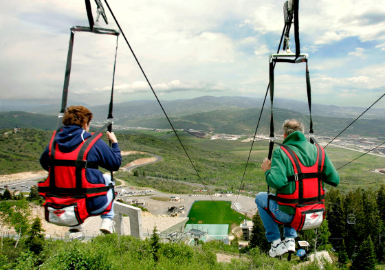 A couple takes off on the Extreme Zip Ride at the Utah Olympic Park in Park City, Utah.