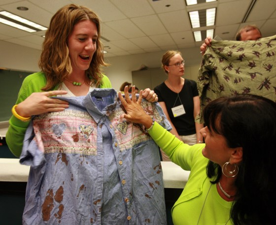 Teachers Jill Francis, left, of Flanagan, Ill., and Shelia Krotz, of San Diego, Calif., participating in a blood spatter analysis workshop during the Forensic Science Educational Conference.