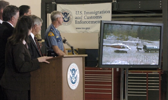 U.S. and Canadian law enforcement agencies show a video on Thursday of a drug smuggling operation on the U.S.-Canadian border in Bellingham, Wash. More than 40 people were arrested, authorities said.