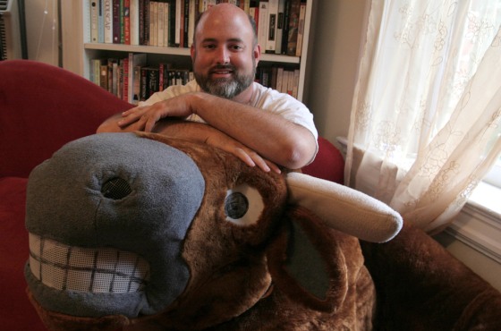 Michael McDonnel, creator of the Dewey Beach Running of the Bull event, is seen with the bull costume he and a friend wear to chase people down the beach, in his living room in Washington D.C., on Wednesday.