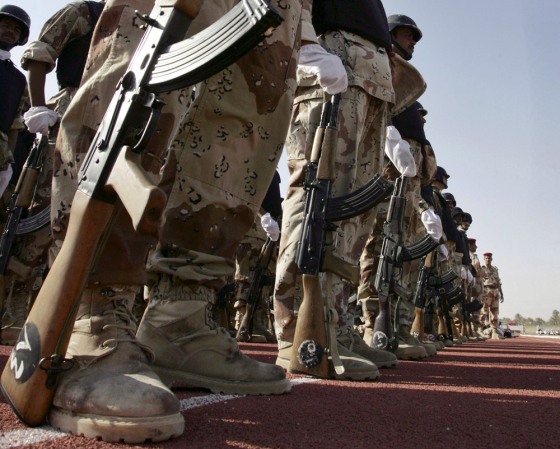 Soldiers stand in attention during a hand-over ceremony in Samawa south of Baghdad