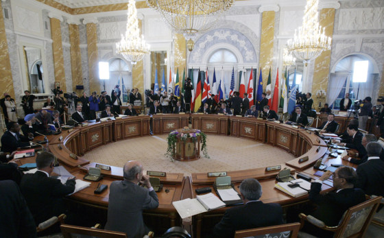 Leaders of the G-8 are joined by other invited world leaders at a meeting during the summit in St. Petersburg, Russia, on Monday.