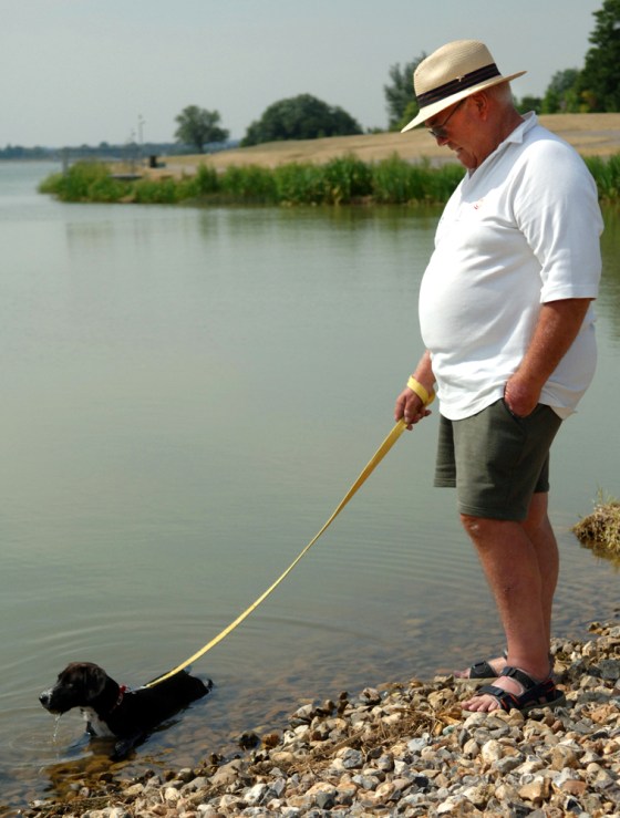 A dog cools off Wednesday in Dorney Lake, Eton, England. In Britain, by mid-afternoon, the temperature at Charlwood, near London's Gatwick Airport, hit 97 degrees, the hottest temperature ever recorded in Britain in July.