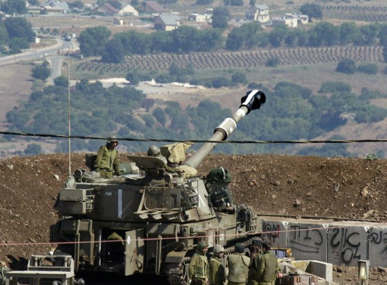 An Israel artillery piece prepares to fire into Lebanon from a position on the border near the town of Moshav Margaliyot, on Wednesday.