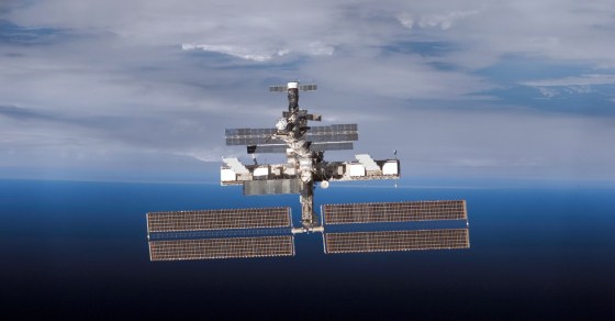 Backdropped by the blackness of space and Earth's horizon, the international space station moves away from the shuttle Discovery on July 15.