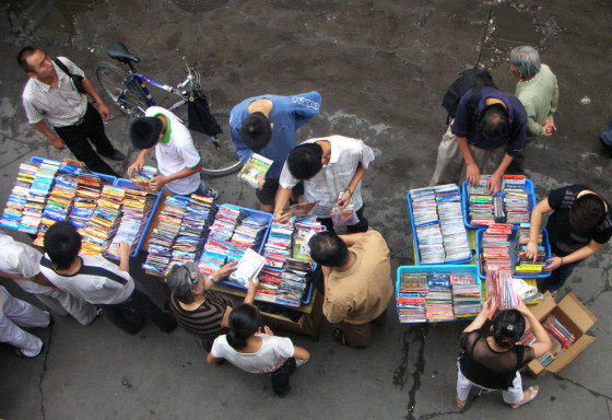 Local residents buy pirated DVDs on a street in Lanzhou, in China's Gansu province. U.S. officials say China's counterfeit exports cost legitimate producers worldwide up to $50 billion a year in lost potential sales.