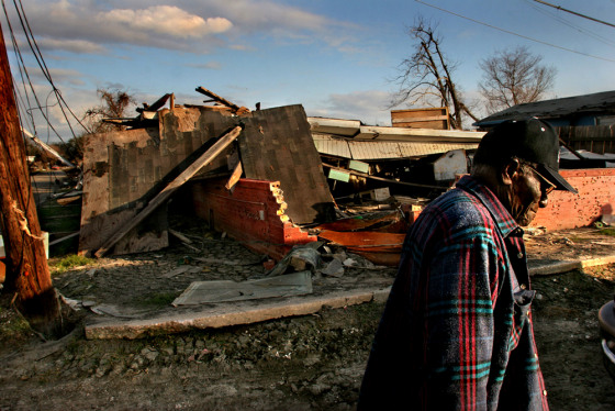 Rollin James, 84,&nbsp;walks past the ruins of a market he and his wife, Victoria, ran for many years in New Orleans Parish on Aug. 11. After months of avoiding the site, they came back to see if they could salvage the cash register, but it was gone. 