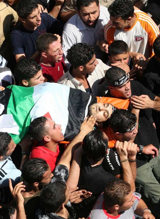 Palestinians carry the body of militant commander Fadi Khafisha of the al Aqsa Martyrs Brigades, part of President Mahmoud Abbas' Fatah group, during his funeral in the West Bank city of Nablus, hours after he was killed by Israeli troops on Thursday.