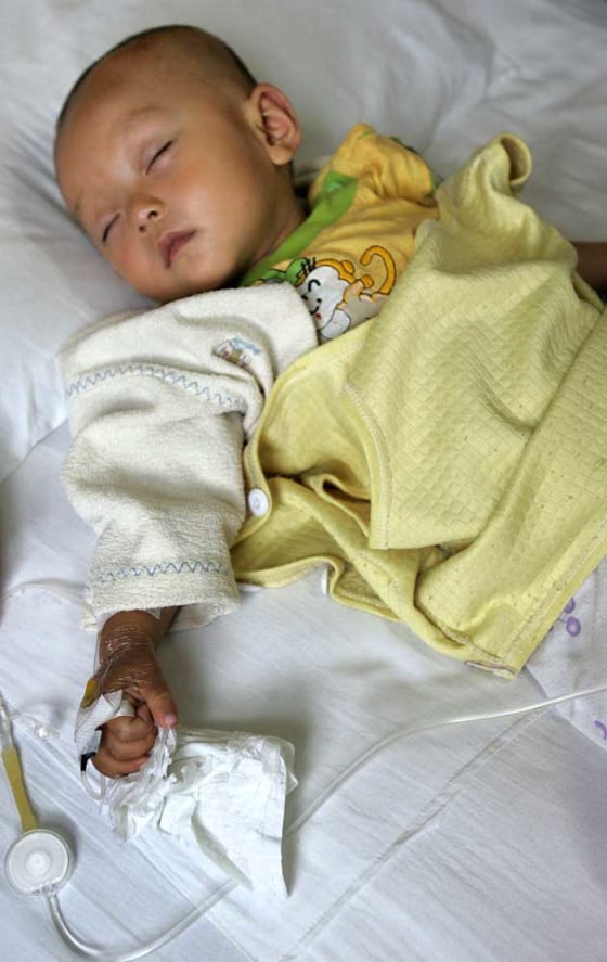 A child receives medical treatment at a hospital in Xi'an, northwestern China's Shaanxi province, on Monday. More than 1,000 villagers from Gansu province are being treated at the hospital for lead poisoning which they say was caused by a local smelting plant.