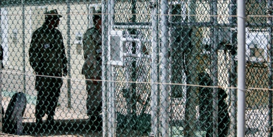U.S. Navy personnel keep guard within the fenced grounds of Camp Delta, at the Guantanamo Bay U.S. Naval Base, in Cuba, on June 27. 