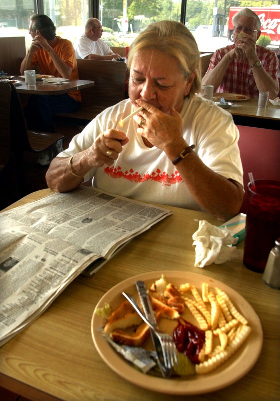 Nancy Baxley takes advantage of the no-children, pro-smoking policy at Smoker's Cafe in Dublin Ga.