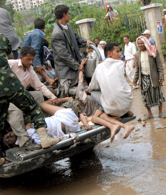 Yemeni army and security trucks carry pe