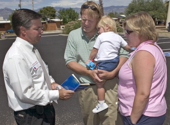 Republican candidate for Congress Randy Graf, left, talks about immigration and citizenship with constituents before they vote in Tucson, Ariz., on Tuesday.
