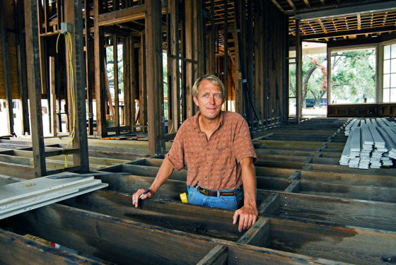 Alan Ramsay stands in the gutted frame of a historic home in Pass Christian, Miss. A shortage of workers is making it impossible for contractors to meet the overwhelming demand for skilled laborers. 