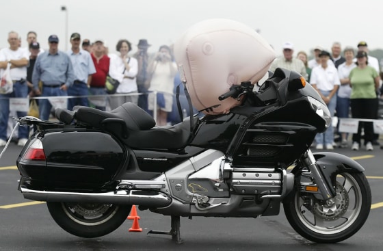 The airbag in a Honda Goldwing motorcycle deploys during a demonstration in Marysville, Ohio. 