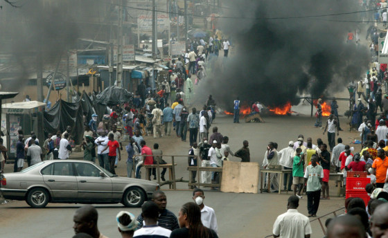 Protestors erect roadblock and light bonfire in Ivory Coast's economic capital Abidjan