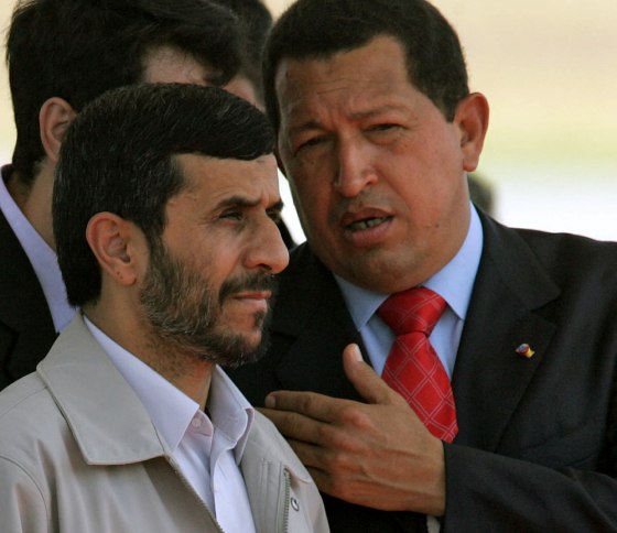 Venezuelan President Hugo Chavez (R) spe