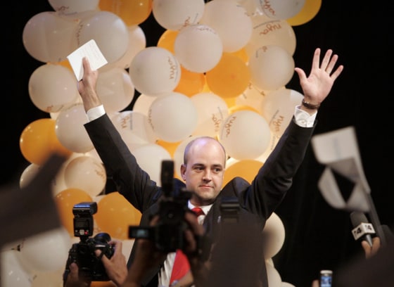 Swedish moderate party leader Fredrik Reinfeldt waves to cheering supporters in Stockholm