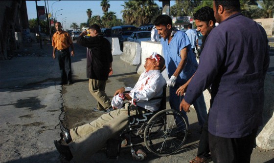 Iraqi medics transfer a man injured in a suicide bomb attack to a Baghdad hospital on Wednesday.