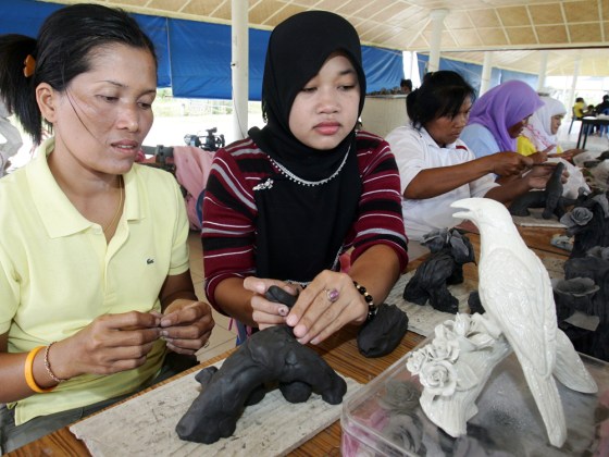 A group of Muslim and Buddhist Thai women attend a ceramics class in Narathawit, Thailand in August. The class is a learning opportunity for women widowed by fighting in southern Thailand.