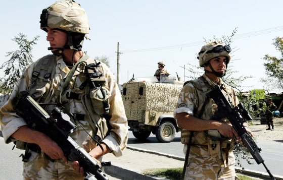 British soldiers stand guard at the site