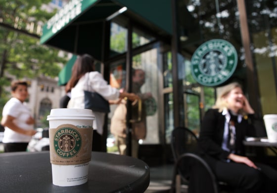 Patrons enter a Starbucks store 22 Septe