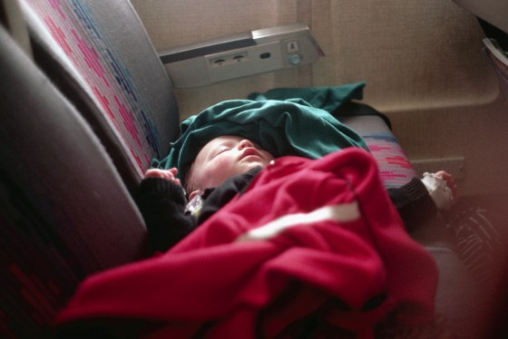 Infant Sleeping on Airplane Seat
