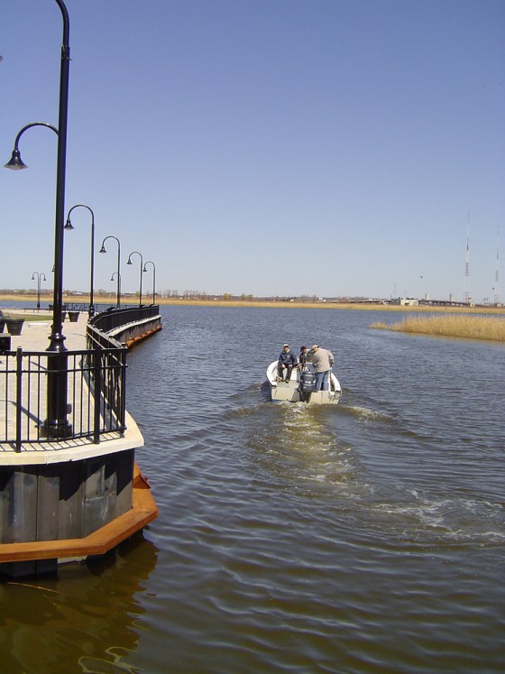 In this file photo, a boat travels through Mill Creek Point Park in Secaucus. N.J. State officials are trying to promote "eco-tourism" — conservation-minded outdoor travel — that is generally identified more with lush, faraway destinations such as Costa Rica or the Galapagos Islands.