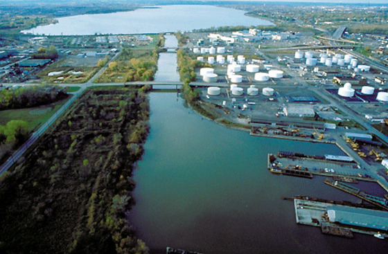 A channel makes its way into Onondaga Lake in Syracuse, N.Y., where Honeywell has agreed to dredge the lakebed to remove mercury and other pollutants.