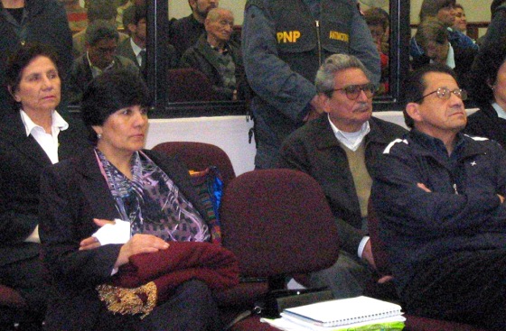 In this photo provided by Poder Judicial, some leaders of the Shining Path guerrilla movement, including the founder and leader, Abimael Guzman, second from right, listen during the trial inside the naval base in Lima, Peru, on Friday.