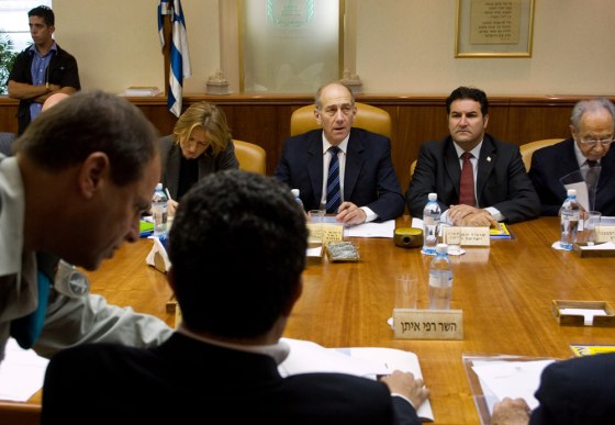 Israeli Prime Minister Ehud Olmert , center, Vice Premier Shimon Peres, right, Foreign Minister Tzipi Livni, left, and Cabinet Secretary Yisrael Maimon, are seen at the weekly cabinet meeting at his Jerusalem office, in this photo taken Sunday.