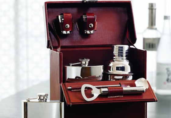 The Red Envelope Leather Travel Bar set comes with four one-ounce shot glasses, two flasks, a shaker, stirrer and a bottle opener.