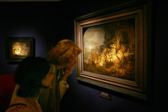 Journalists look at 'The preaching of John the Baptist' by Dutch master Rembrandt, as they tour the exhibit 'Rembrandt and Uylenburgh, Dealing in Masterpieces' during a press preview at Rembrandt House Museum in Amsterdam, Sept. 14th. The show was the 11th in a series of special exhibitions marking the 400th year of Rembrandt's birth.