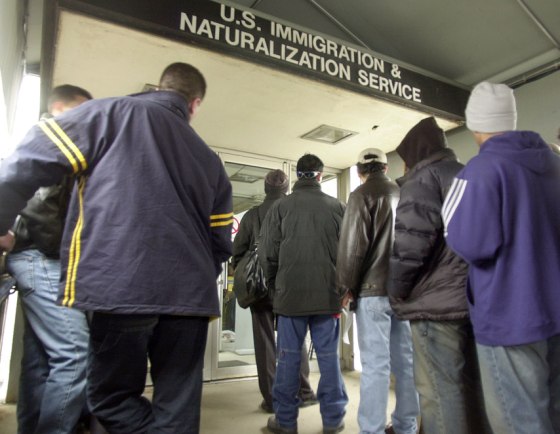 People line up outside the Immigration and Naturalization Service office in Detroit in Jan. 2002. Immigration officials say phony green-card marriages are a growing crime.