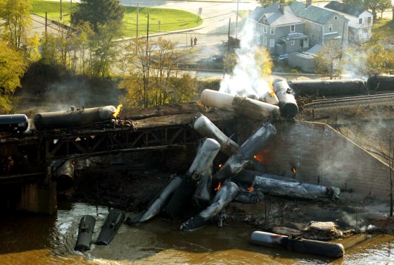 Flames and smoke rise Saturday from a derailed Norfolk Southern train in New Brighton, Pa. Twenty-three cars containing ethanol derailed on a bridge over the Beaver River in New Brighton, about 25 miles northwest of Pittsburgh, on Friday night.