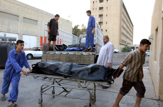 Tikrit hospital morgue workers unload bodies of people killed in recent sectarian violence in the town of Balad Saturday Oct. 21, 2006. More than 100 people were slain in Balad, about 90 Km south of Tikrit, during the past week.