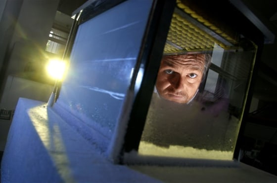 Henrik Svensmark, head of the research team at the Danish National Space Center, looks through a small cloud chamber.