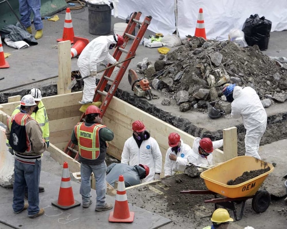 Workers search the area where human remains were found at the site of the World Trade Center in New York City.