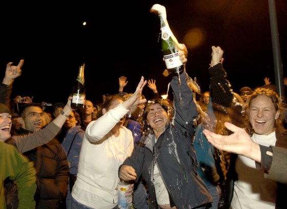 Gallaudet University students, staff and alumni celebrate outside Fowler Hall after the board made its decision.