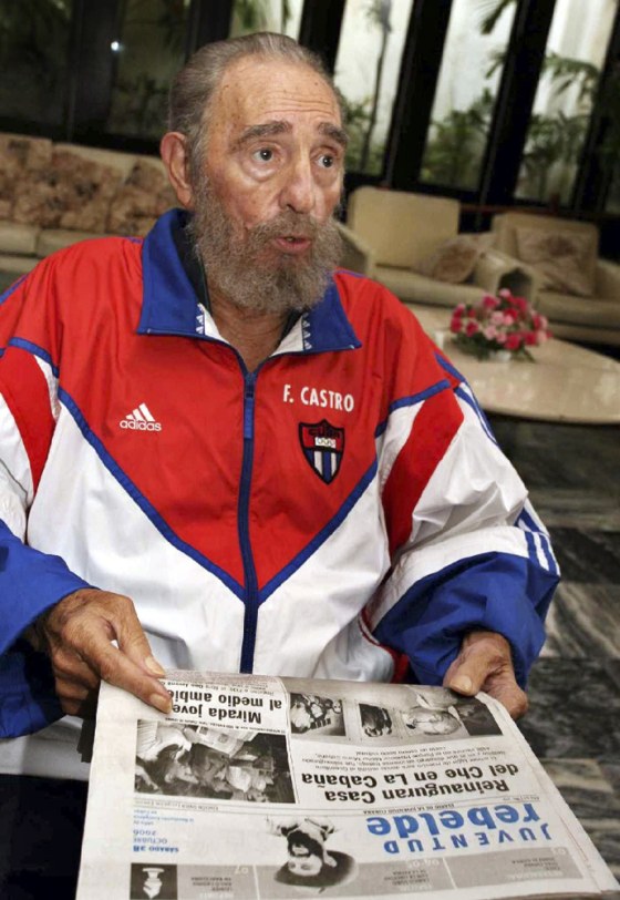 Cuba's President Castro holds local Saturday newspaper in Havana