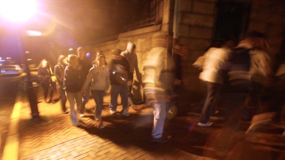 A group on a ghost tour walks the historic east side of Providence, R.I. earlier this month.