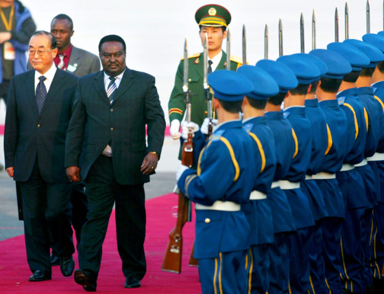 Angolan Prime Minister Fernando da Piedade Dias dos Santos inspects the Chinese guard of honor after his arrival in Beijing, China on Thursday.