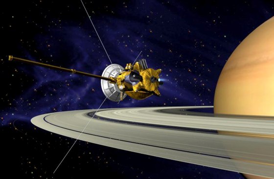 An artist's view shows the Cassini orbiter passing by Saturn's rings.